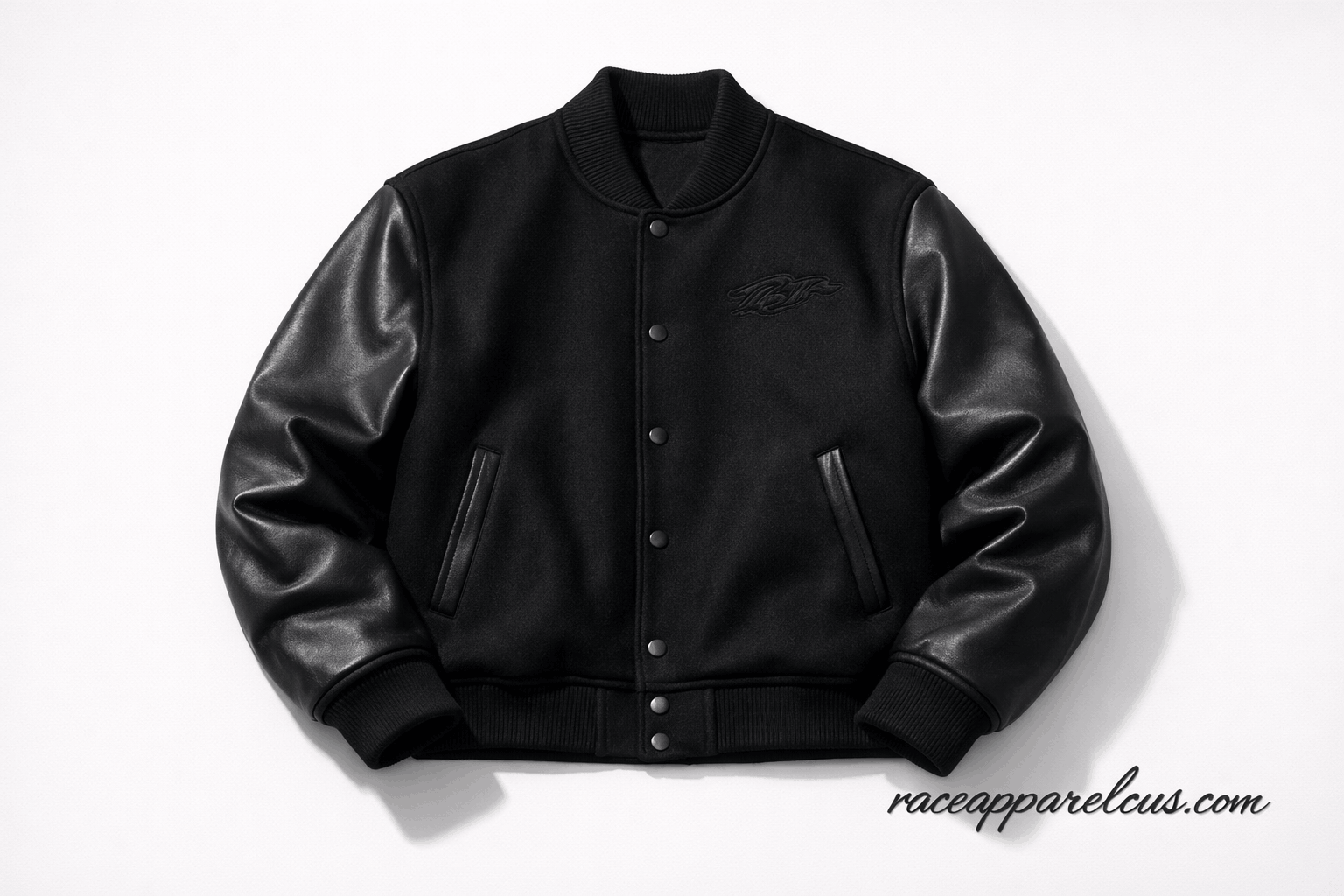 Premium all black varsity jacket with tonal embroidery on white background — featured image for 2026 style guide