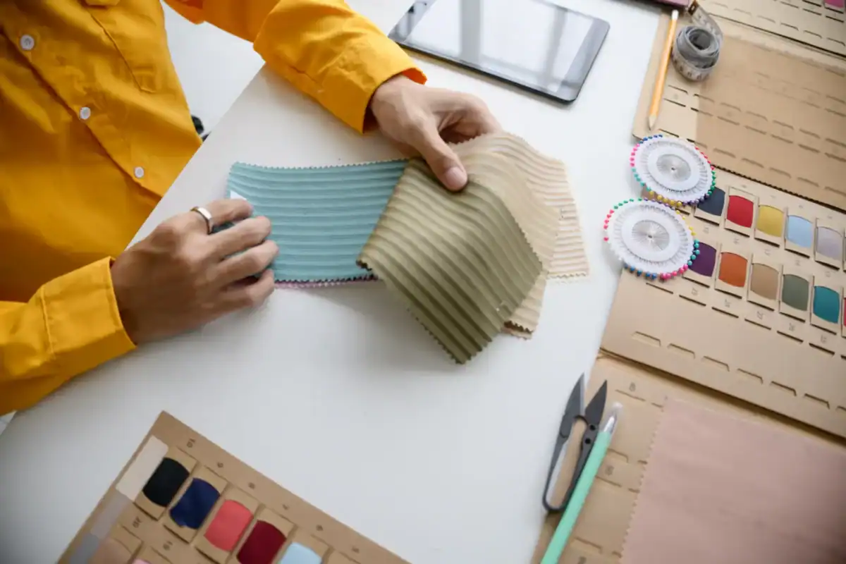 Buyer reviewing a tech pack and sample garment